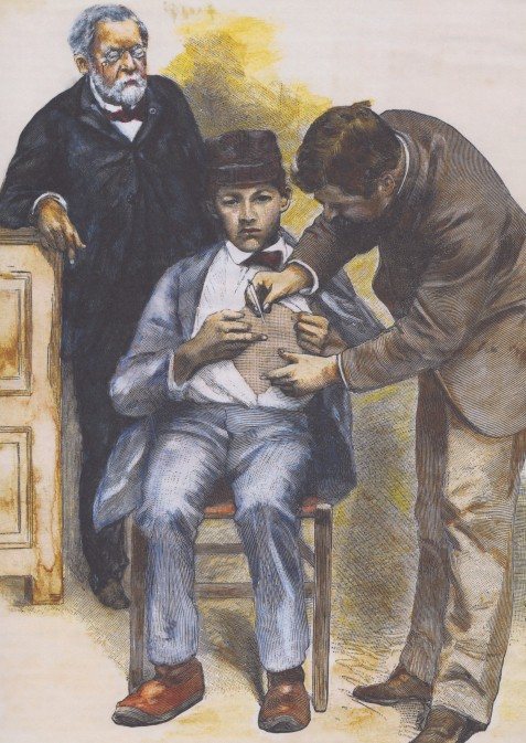 A doctor injects a young Frenchman with a fresh rabies vaccine