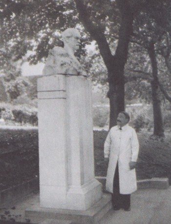Joseph Meister next to the monument to Louis Pasteur in 1935